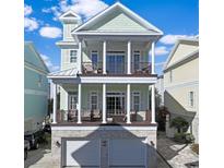 Charming two-story home with double balconies and a two-car garage at 305 Shuffleboard Ct., Myrtle Beach, SC 29572