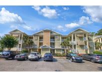Charming multi-Gathering building featuring three stories with multiple balconies and ample parking at 82 Mingo Dr. # 2D, Pawleys Island, SC 29585