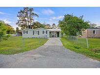 Charming single-story home with a fenced yard, driveway, and covered porch at 109 Plum Ln., Andrews, SC 29510