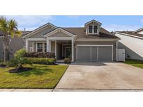 Charming single-story home with well-manicured lawn and attached two-car garage, in a desirable neighborhood at 1741 Parish Way, Myrtle Beach, SC 29577