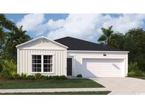 Charming single-Gathering home featuring a two-car garage, manicured lawn, and classic architectural details at 234 Ladyfish Loop, Sunset Beach, NC 28468