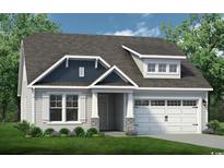 Charming single-Gathering home featuring a two-car garage, stone accents, and a well-manicured lawn at 811 Big Cedar Dr., Loris, SC 29569