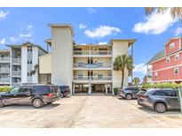 South Shores building featuring parking, balconies, and a sign at 1119 S Ocean Blvd. # 8, Surfside Beach, SC 29575