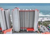 A multi-story beachfront condo building, with balconies offering ocean views at 1625 S Ocean Blvd. # 211, North Myrtle Beach, SC 29582