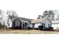 Charming single-story home with manicured landscaping and a welcoming entrance at 4333 Oakwood Circle, Little River, SC 29566