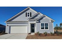 Charming home featuring light-blue siding, a garage, and a black front door at 501 Haven View Way, Murrells Inlet, SC 29576