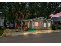 Charming home with a lush palm tree and pink shutters, offering a cozy coastal vibe at 6001-T3 S Kings Hwy., Myrtle Beach, SC 29575