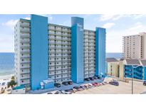 The Water's Edge resort building offers beachfront condo living with private balconies and plentiful parking for owners and guests at 1012 N Waccamaw Dr. # 1107, Murrells Inlet, SC 29576