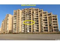Stunning oceanfront condo building with private balconies and beach access at 1690 N Waccamaw Dr. # 504, Garden City Beach, SC 29576