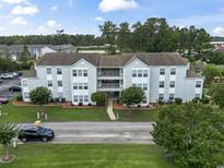 A well-maintained apartment complex with manicured landscaping and visible parking at 2280 Andover Dr. # C, Surfside Beach, SC 29575