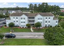 Well-maintained apartment complex with manicured lawn and landscaping at 2280 Andover Dr. # L, Surfside Beach, SC 29575