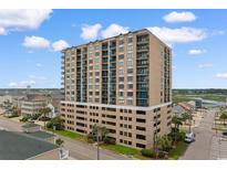 Multi-story condominium building featuring multiple balconies offering views of the surrounding coastal landscape at 4103 N Ocean Blvd. # 707, North Myrtle Beach, SC 29582
