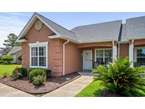 Charming, single story townhome featuring a quaint porch and well-maintained landscaping at 4648 Lightkeepers Way # 39A, Little River, SC 29566