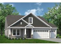 Charming home with a two-car garage, stone accents, a covered entrance, and lush green landscaping at 1571 Breakwater Dr., Little River, SC 29566