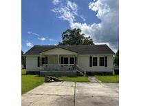 Charming single-story home featuring a welcoming front porch and classic architectural details at 2432 Farmwood Circle, Conway, SC 29527