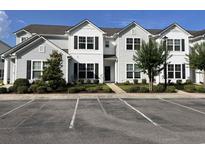 Charming two-story condo with manicured landscaping and ample parking at 318 Castle Dr. # 1443, Myrtle Beach, SC 29579