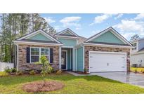 Inviting exterior featuring stone accents, turquoise siding, and a well-manicured lawn at 725 Doonbeg Ct., Conway, SC 29526
