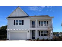 Charming two-story home with white siding, black shutters, and a two-car garage at 741 Doonbeg Ct., Conway, SC 29526