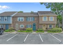 Charming townhome complex with well-maintained brick facade and colorful front doors at 830 44Th Ave. N # T3, Myrtle Beach, SC 29577
