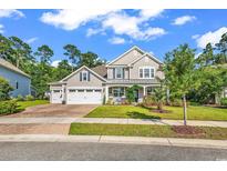 Inviting two-story home with a three-car garage, well-manicured lawn, and charming front porch at 1662 Westminster Dr., Myrtle Beach, SC 29577