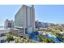 Exterior of the Sand Dunes Resort building showing the outdoor waterpark and ocean views at 201 74Th Ave. N # 707, Myrtle Beach, SC 29572