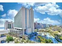High-rise Sand Dunes resort condominium exterior featuring a waterpark and blue skies at 201 74Th Ave. N # 707, Myrtle Beach, SC 29572