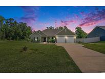Charming single-story home with a manicured lawn and a two-car garage in a quiet neighborhood at 2080 Highway 915, Loris, SC 29569