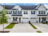 Charming townhouse exterior with white siding, blue shutters, and well-manicured landscaping at 2352 Elowen Ln. # 22B, Longs, SC 29568
