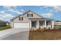 Charming single-story home with a manicured front yard and a two-car garage at 3558 Ashridge Way, Conway, SC 29526