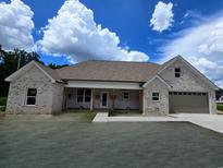 Charming single-story brick home featuring a two-car garage and covered front porch at 3619 Allentown Dr., Conway, SC 29526