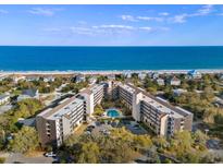 Stunning aerial view of an oceanfront condo complex with a pool and beach access at 423 Parker Dr. # 613, Pawleys Island, SC 29585