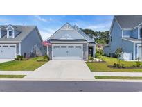 Charming home with a two-car garage, well-manicured lawn, and attractive curb appeal at 598 Cascade Loop, Little River, SC 29566