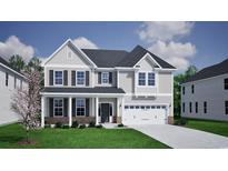 Charming two-story home with gray siding, black shutters and inviting covered front porch at 1114 Laconic Dr., Myrtle Beach, SC 29588
