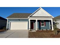 Charming single-Gathering home with a two-car garage and a beautifully landscaped front yard at 173 Dagger Ct., Myrtle Beach, SC 29588