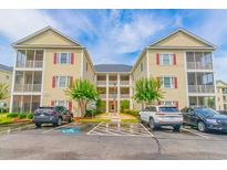 Attractive multi-Gathering building with a well-maintained parking area and landscaped surroundings at 2060 Cross Gate Blvd. # 102, Surfside Beach, SC 29575
