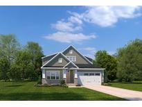Charming two-story home featuring stone accents, neutral siding, a two-car garage, and a beautifully landscaped front yard at 2353 Hazel Way, Longs, SC 29568
