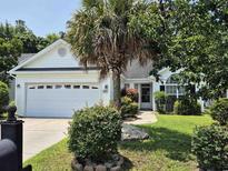 Charming single-story home with well-manicured lawn, mature landscaping and a two-car garage at 244 Colby Ct., Myrtle Beach, SC 29588