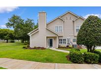 Charming home with a manicured lawn, mature trees, and cozy exterior design details at 503 20Th Ave. N # 29-C, North Myrtle Beach, SC 29582