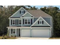 Charming two-story home with light blue siding, black shutters, and a two-car garage at 7179 Shooting Star Way, Myrtle Beach, SC 29579