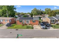 Charming brick home with manicured lawn and solar panels on roof at 1145 Forest Dr., North Myrtle Beach, SC 29582