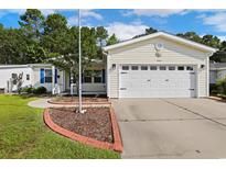 Charming single story home with a well manicured lawn, vinyl siding and a two car garage at 333 Walden Lake Rd., Conway, SC 29526