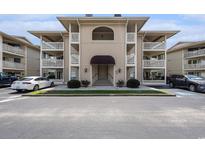 Attractive condo building exterior featuring a covered entrance and multiple balconies at 4290 Pinehurst Circle # B3, Little River, SC 29566