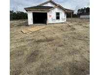 New home construction featuring protective wrap on exterior and attached garage at 5725 S Highway 41, Marion, SC 29571