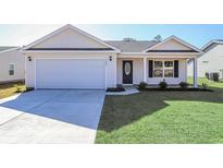 Charming single-Gathering home featuring a two-car garage and a well-manicured lawn at 655 Snowy Owl Way, Conway, SC 29527