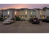 Charming townhomes with colorful exteriors and dedicated parking spaces for residents and visitors at 6703 Jefferson Pl. # G5, Myrtle Beach, SC 29572