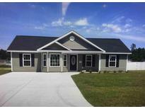 Charming one-story home featuring a well-maintained lawn and a concrete driveway at Tbb 1 St. John Rd., Galivants Ferry, SC 29544