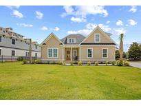 Charming home with a manicured lawn, complemented by tasteful landscaping and a welcoming front porch at 2313 Summersweet Ln., Myrtle Beach, SC 29579