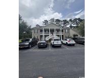 Traditional style two story home with a welcoming exterior and multiple parking spaces at 448 Mahogany Dr. # 201, Murrells Inlet, SC 29576