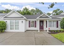 Charming single-story home with white siding, a well-manicured lawn, and a welcoming front entrance at 462 Wallingford Circle, Myrtle Beach, SC 29588