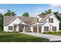 Charming home boasts a symmetrical facade, wooden accents, multi-car garage, and manicured lawn at 558 Oxbow Dr., Myrtle Beach, SC 29579